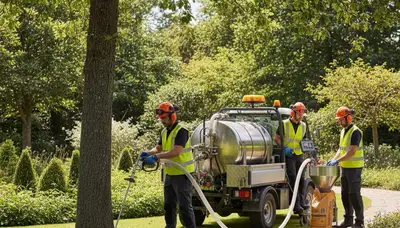 Tree service technician fertilizing trees in Saugus, MA for healthier roots and growth